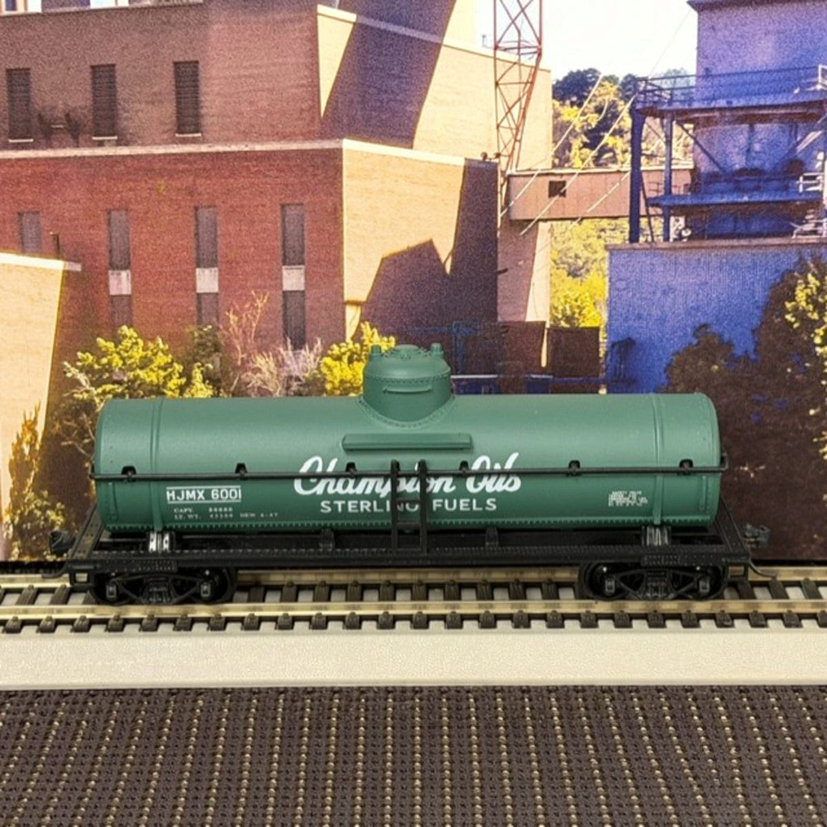 #1605 Model Power HO Scale Champion Oils / Sterling Fuels Tank Car